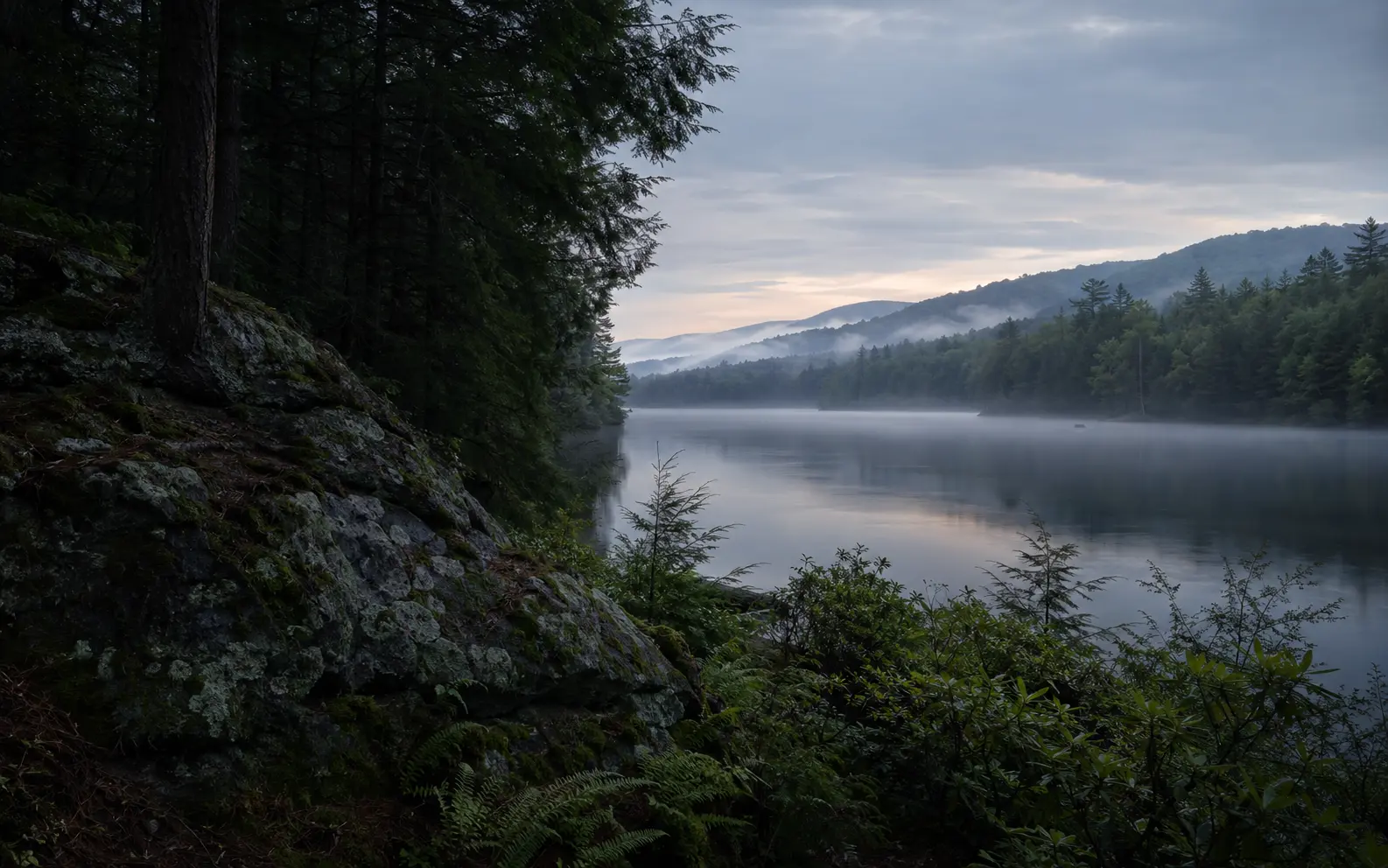 Conceptual editorial Pocono Mountains scene with hemlock forest, lake reflection, and stone